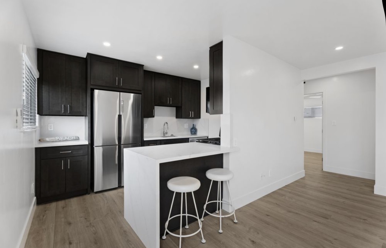 Apartment renovation open kitchen island bar stools San Diego - Complete Builders Inc