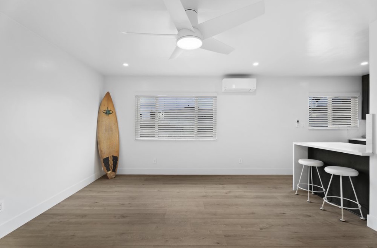 Apartment renovation living area hardwood floors mini split San Diego - Complete Builders Inc