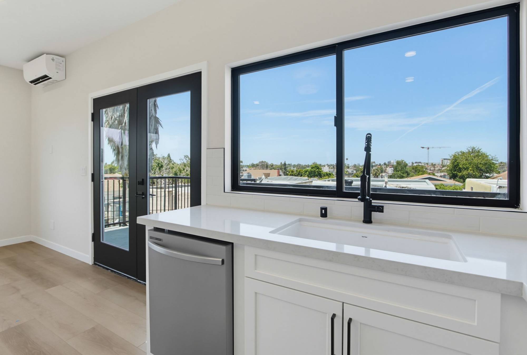 Two-story ADU kitchen sink with panoramic city view, San Diego