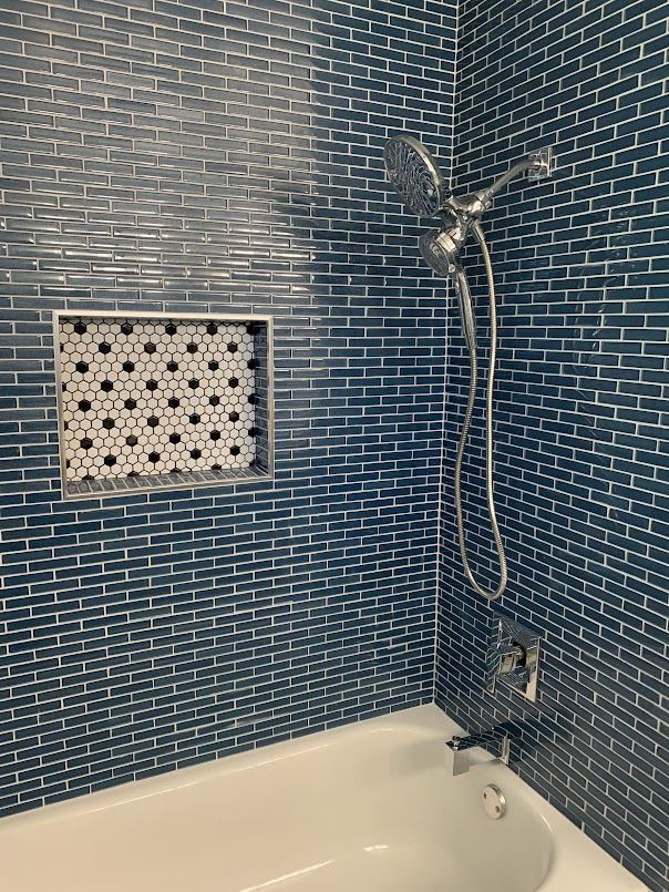 Remodeled tub and shower with blue mosaic tile and hex tile niche, San Diego