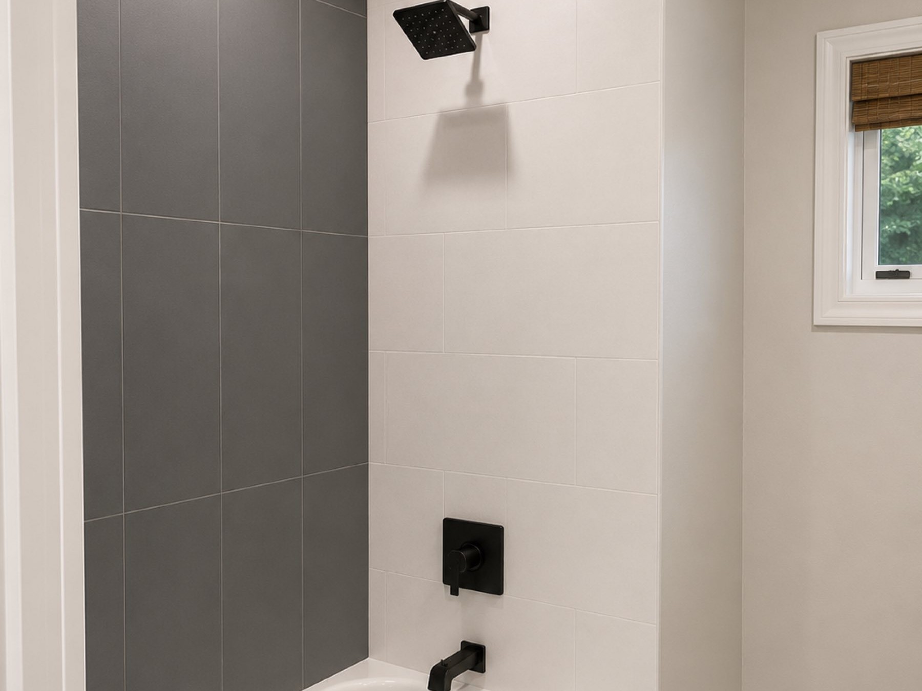 Tub and shower matte black fixtures charcoal accent tile San Diego - Complete Builders Inc