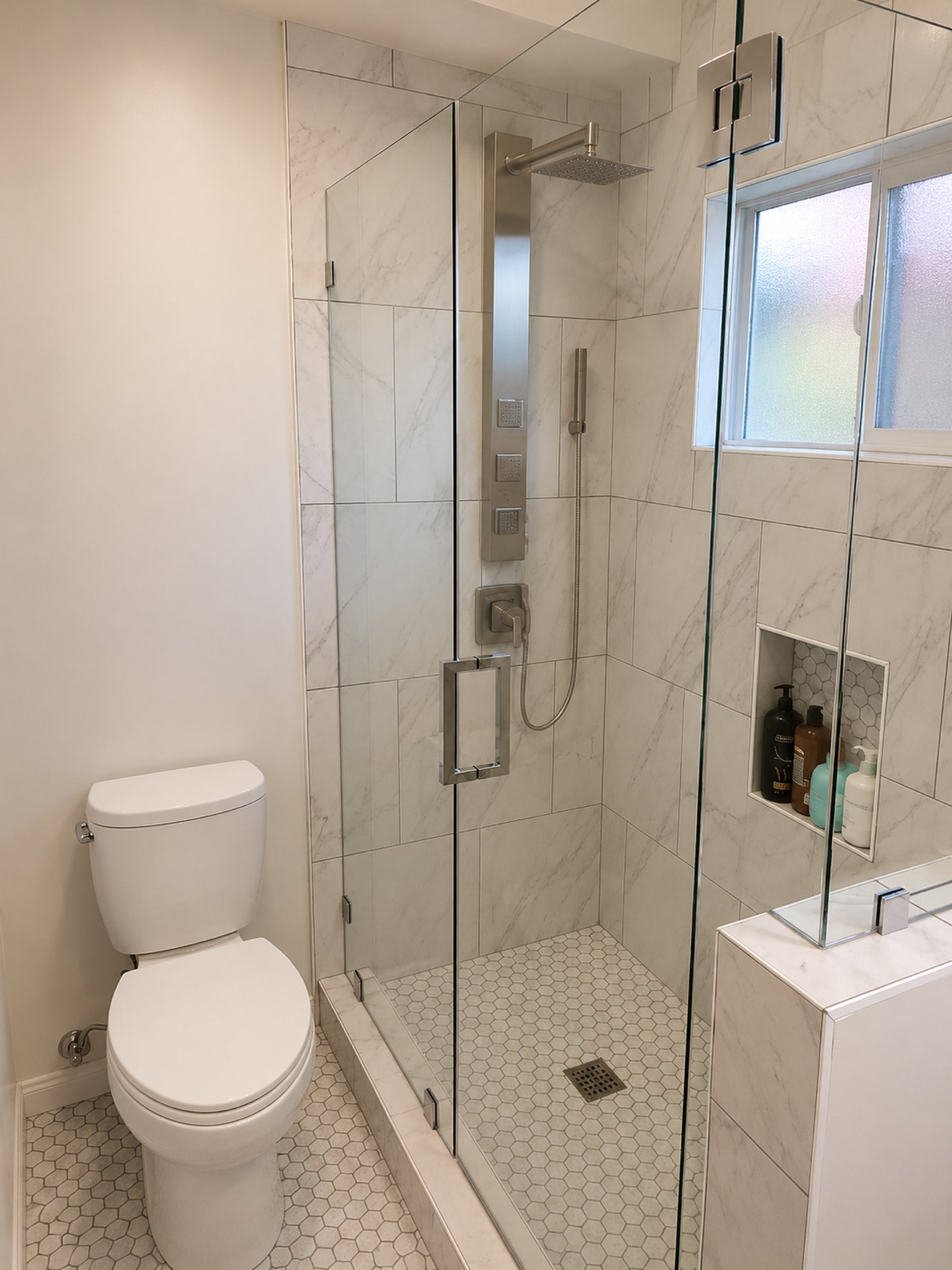 Bathroom marble and penny tile shower San Diego