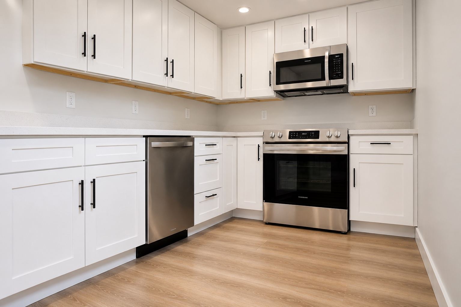 Kitchen remodel with white shaker cabinets and stainless appliances, San Diego