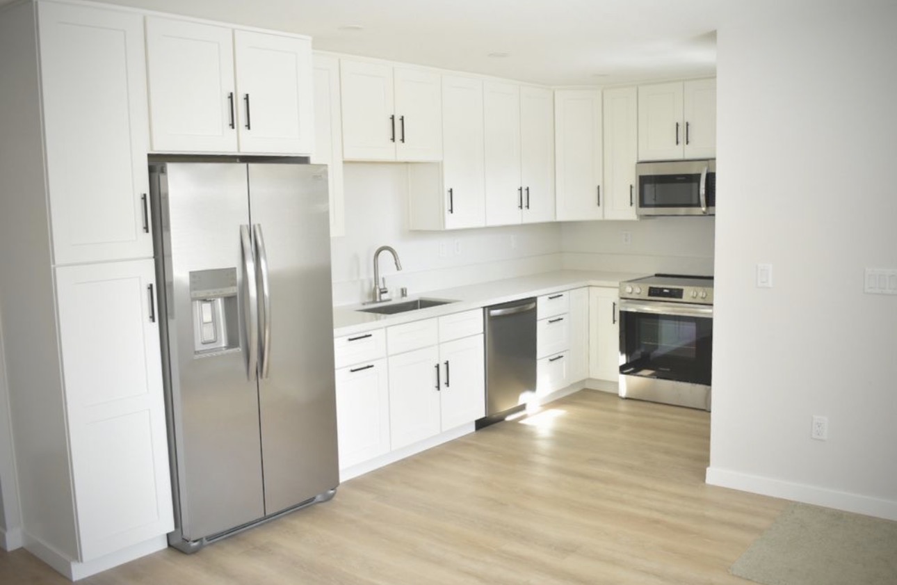 Kitchen remodel white shaker cabinets stainless appliances San Diego - Complete Builders Inc