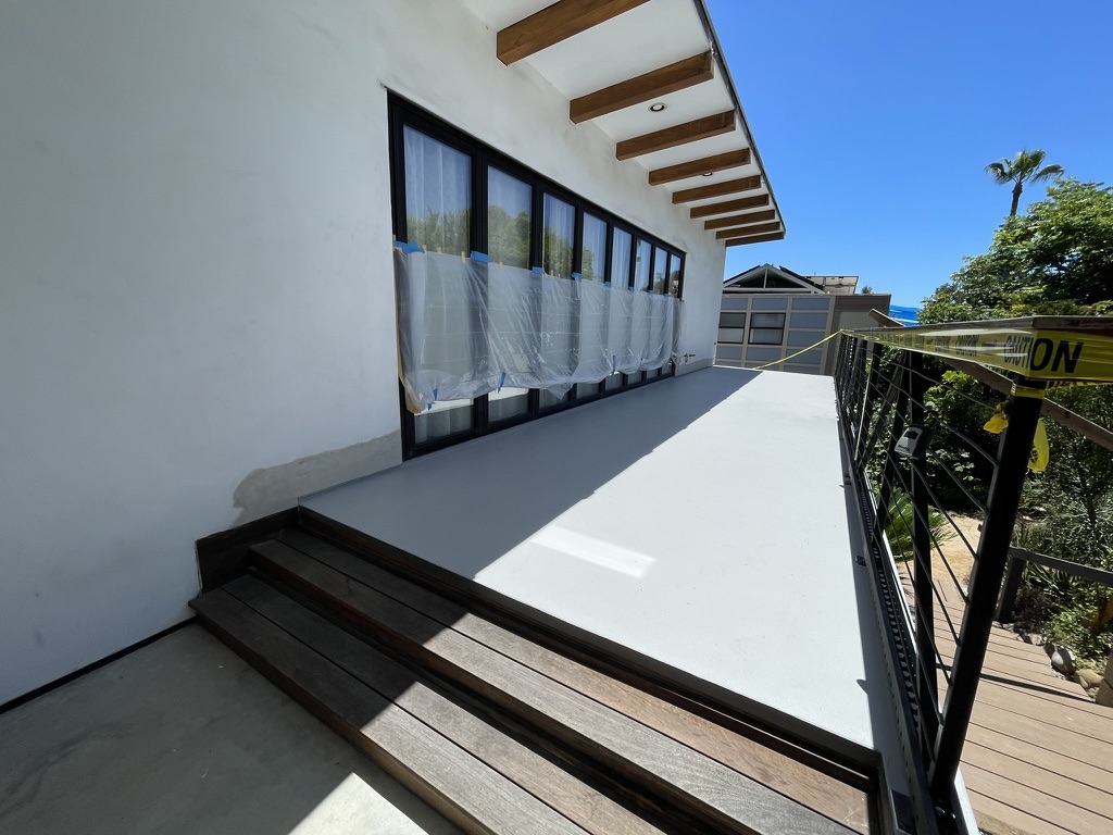 Rooftop deck waterproof coating and steel railing installation San Diego - Complete Builders Inc