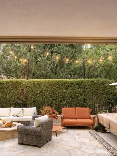 Interior view through bifold doors to flagstone patio San Diego - Complete Builders Inc