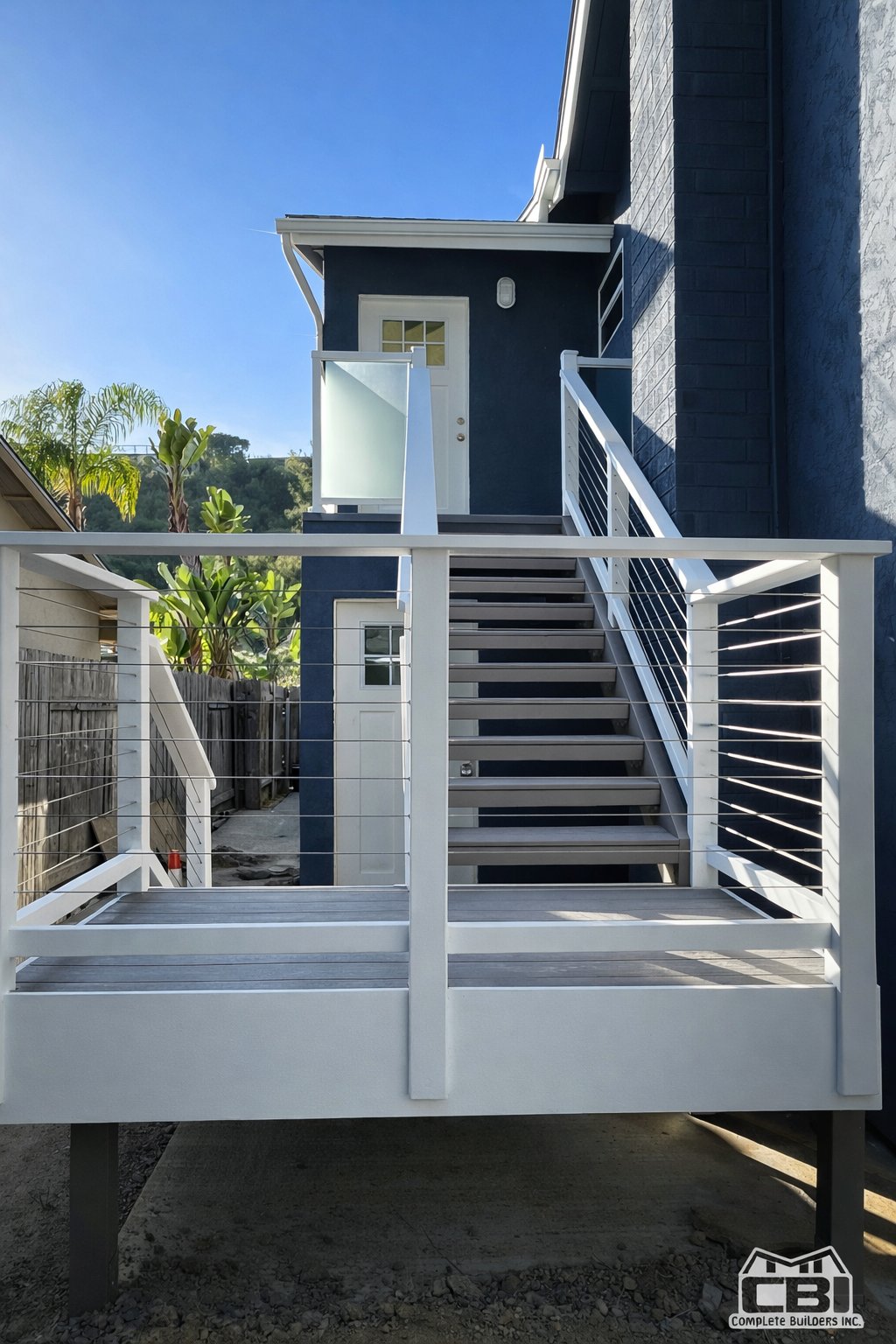 Completed room addition cable rail deck and staircase San Diego - Complete Builders Inc