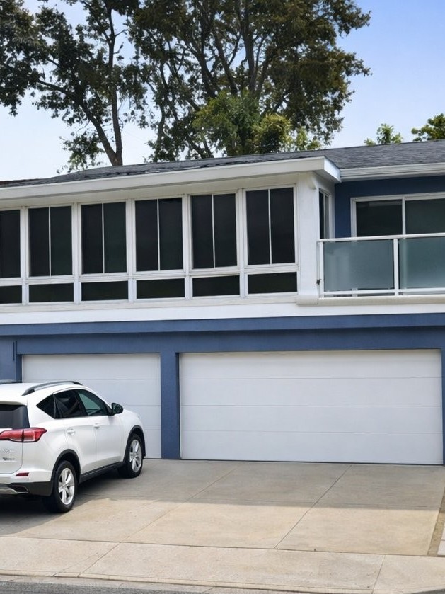 Completed sunroom room addition exterior with wrap-around windows San Diego - Complete Builders Inc