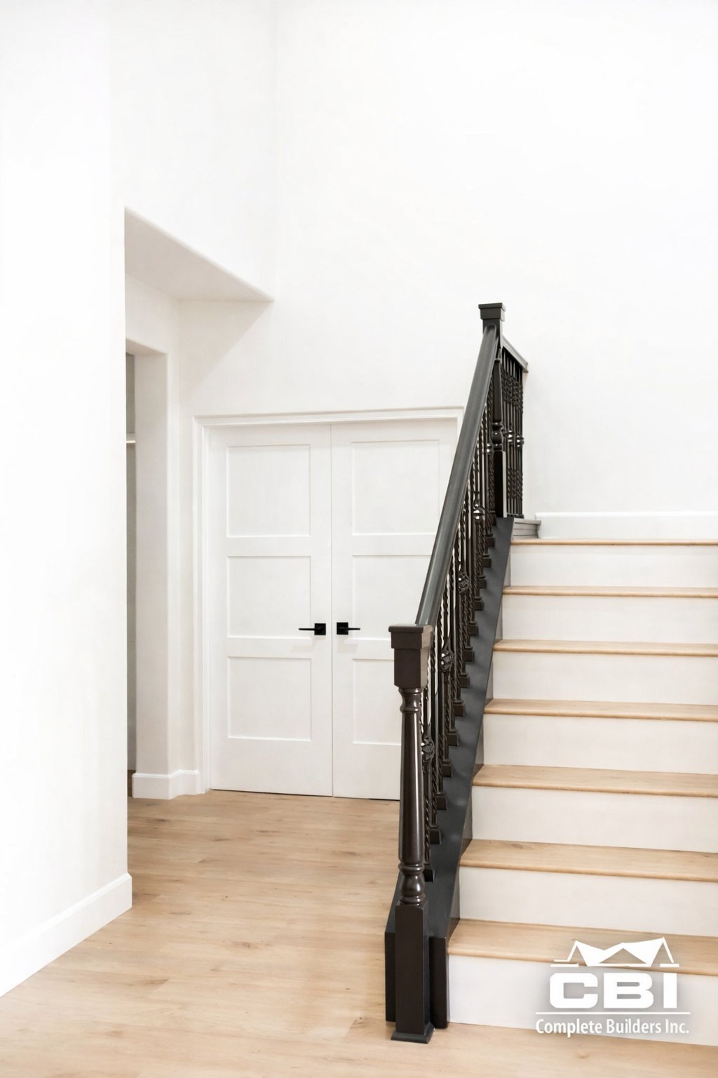 Second story room addition custom iron staircase white oak treads San Diego - Complete Builders Inc